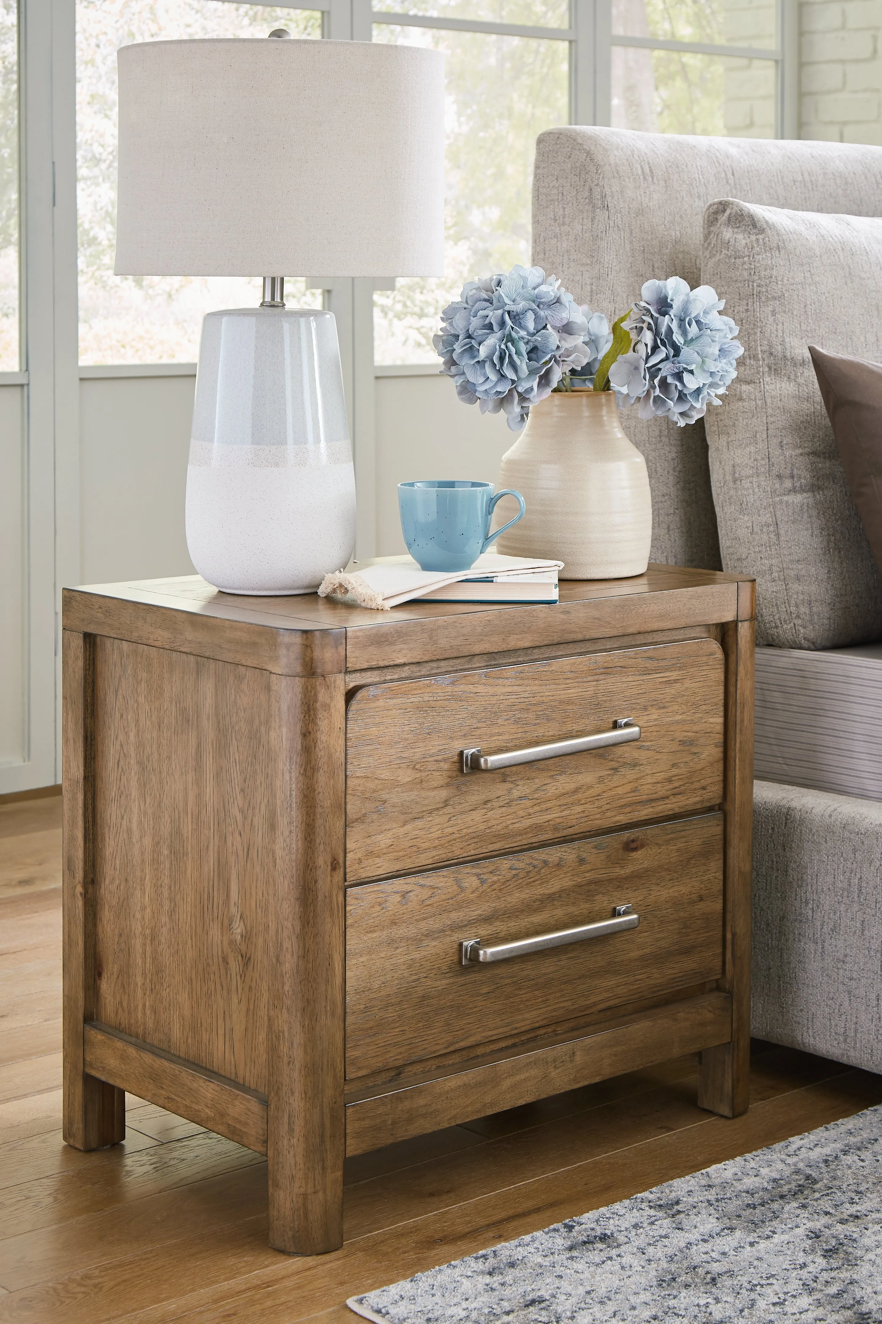 Cabalynn King Upholstered Bed with Mirrored Dresser, Chest and Nightstand in Light Brown