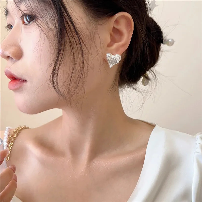 Silver Hammered Heart Coil Clip On Earrings