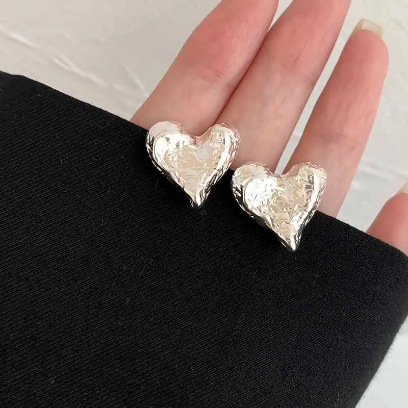 Silver Hammered Heart Coil Clip On Earrings