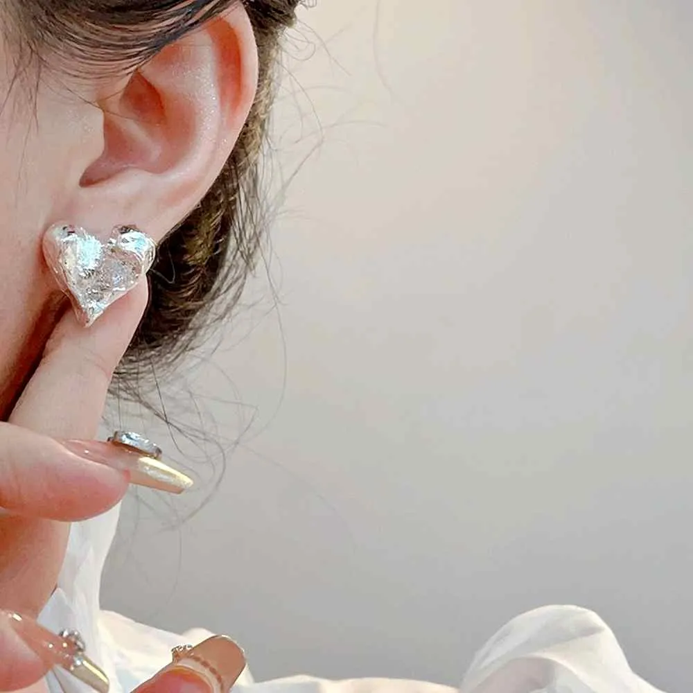 Silver Hammered Heart Coil Clip On Earrings